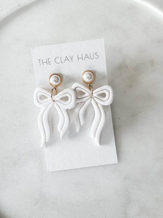 White Bow with Gold Pearl